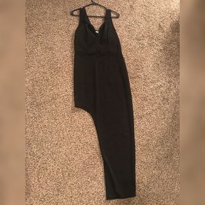 Long black formal style dress with thigh cut out.